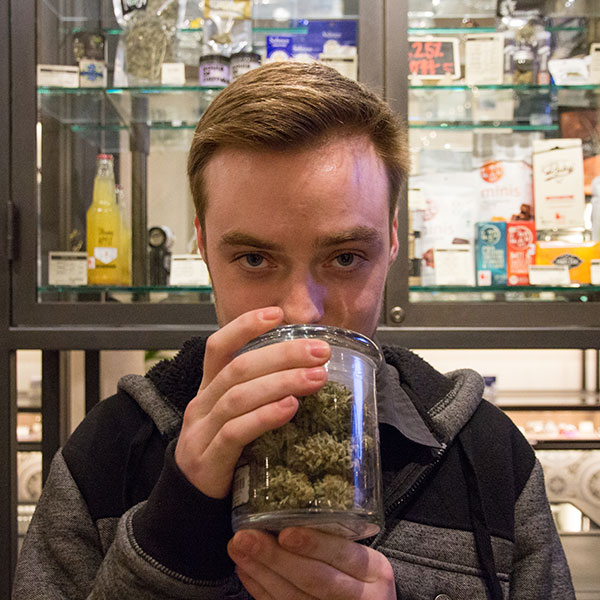 Breathe Easier with Filter420 - Customer Smelling Jar of Cannabis